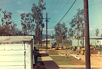 Some guys working on the street in front of the trailers